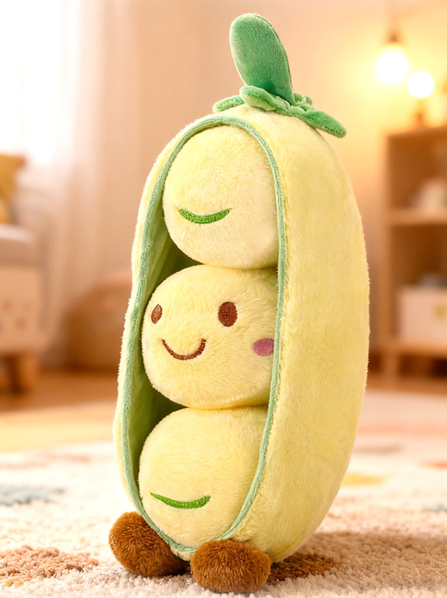 Green pea pod plush toy with three removable round peas featuring cute smiley face expressions, made of soft short plush material.